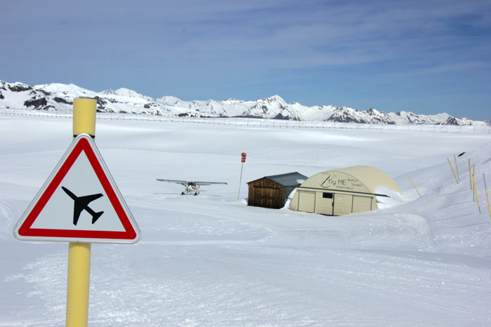 Airstrip sign and light aircraft, Val Thorens