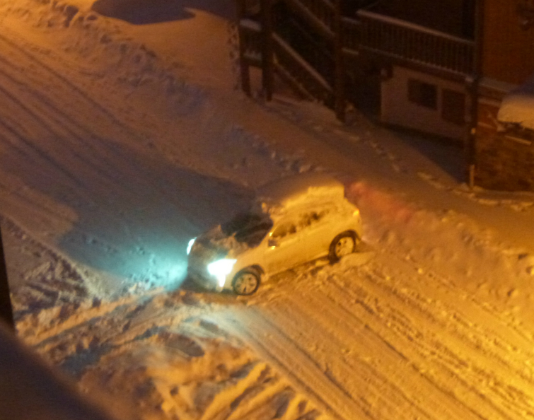 Snow-covered car in Val Thorens